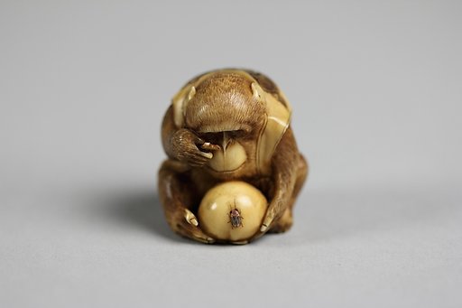 Netsuke of Monkey Looking at a Fly through a Magnifying Glass