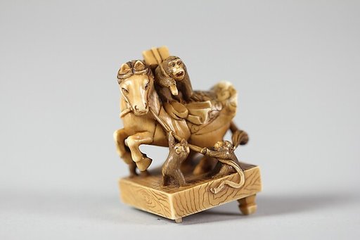 Netsuke of a Horse on a Pedestal with Monkeys Playing About