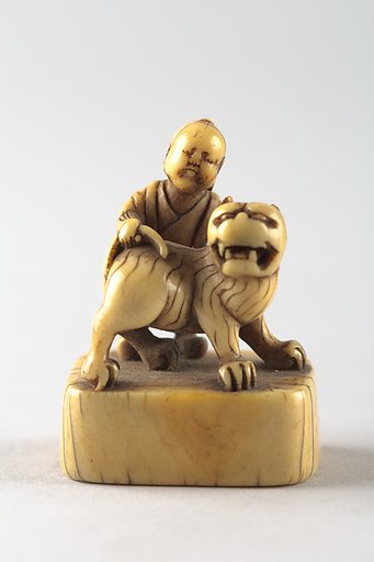 Netsuke of Boy with Dog