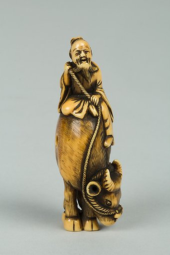 Netsuke of Man Riding a Buffalo