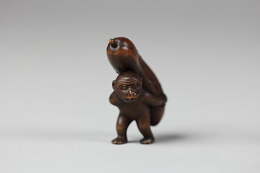 Netsuke of Monkey Carrying a Cucumber on His Back
