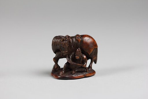 Netsuke of Monkey Holding Horse Rein
