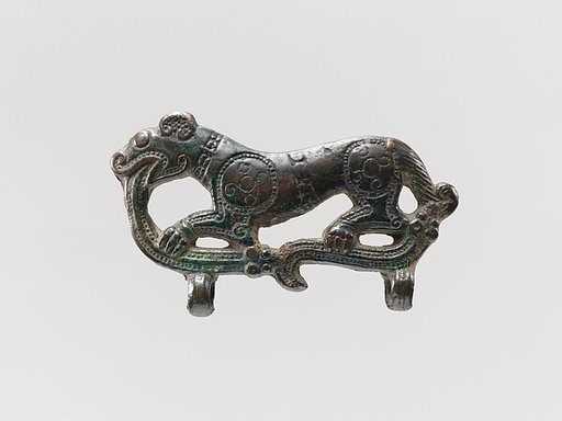 Plaque or buckle