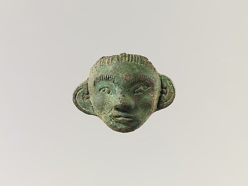 Mounting in Form of a Human Mask