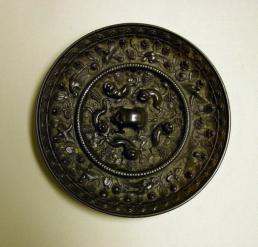 Mirror with fantastic animals amid grape vines