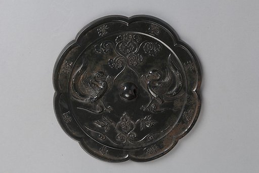 Mirror with paired birds and floral designs