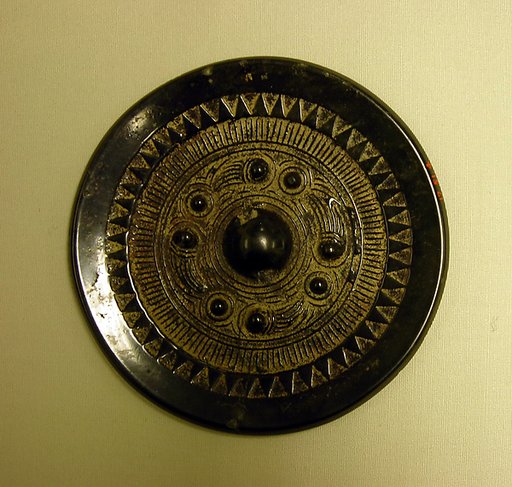 Mirror with knobs and swirls
