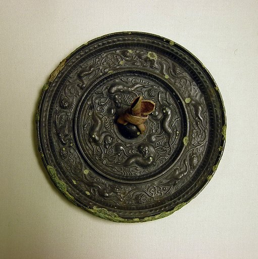 Mirror with fantastic animals