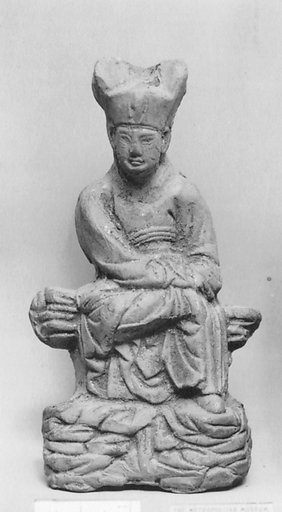 Figure of a seated official