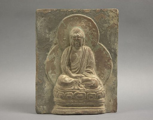 Tile with seated Buddha