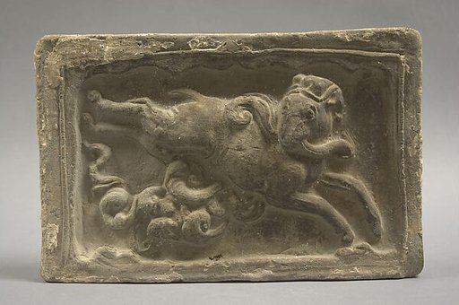 Tile with leaping goat