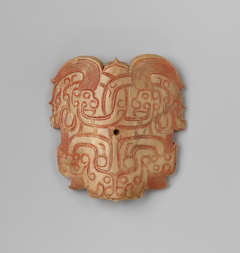 Plaque with mask designs