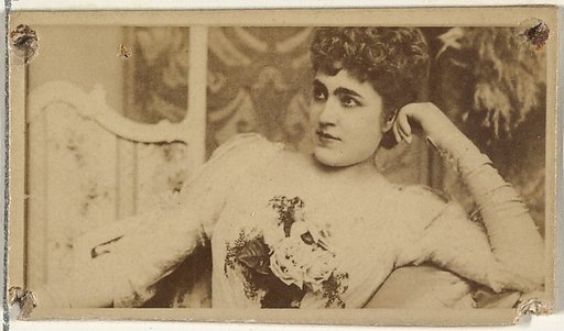 [Actress lounging while holding bouquet of flowers], from the Actors and Actresses series (N145-8) issued by Duke Sons & Co. to promote Duke Cigarettes