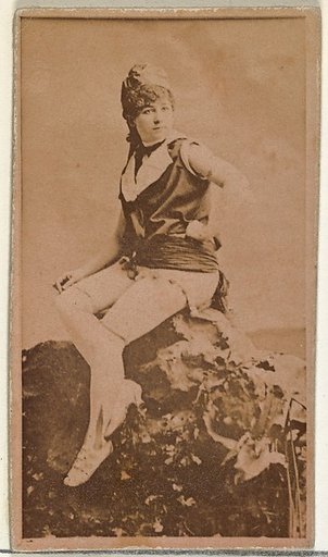 [Actress in studio posing on prop boulder], from the Actors and Actresses series (N145-8) issued by Duke Sons & Co. to promote Duke Cigarettes