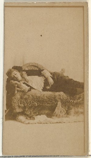[Actress reclining on furs], from the Actors and Actresses series (N145-8) issued by Duke Sons & Co. to promote Duke Cigarettes