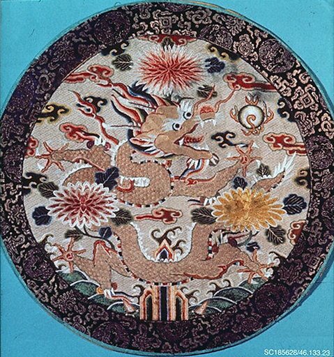 Festival badge with five-clawed dragon surrounded by chrysanthemums