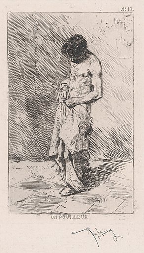 Young man standing dressed in rags