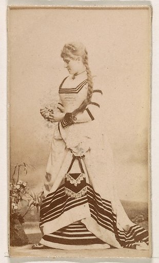Standing actress in striped gown, from the Actresses series (N245) issued by Kinney Brothers to promote Sweet Caporal Cigarettes