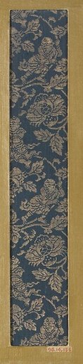 Textile fragment with pattern of Chinese boys on flowering branches