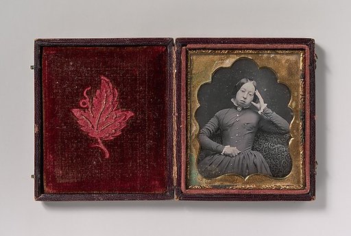 [Seated Woman Wearing Glasses]