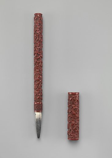 Brush with plum blossoms