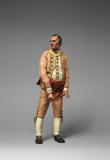 Gentleman with pot belly in salmon colored outfit with buttons