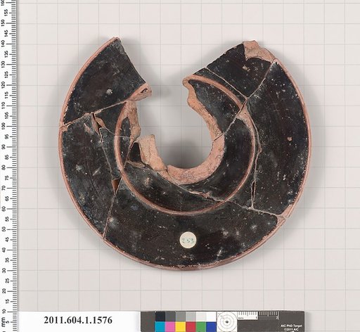 Terracotta fragment of a kylix (drinking cup)