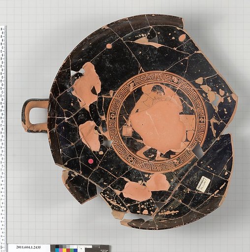 Terracotta fragment of a kylix (drinking cup)