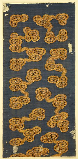 Textile fragment with stylized clouds