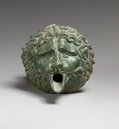 Bronze water spout in the form of a lion mask (one of a pair)