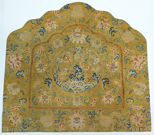 Cushion cover with medallion of longevity among flower scrolls