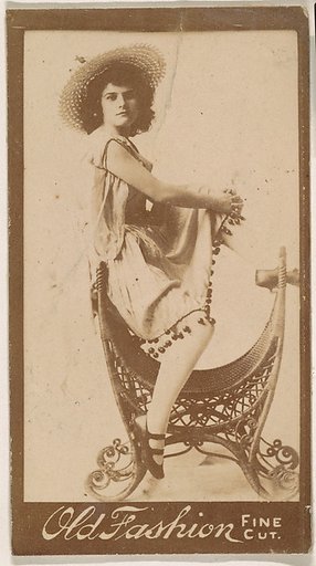 Actress perched on elaborate chair, from the Actresses series (N664) promoting Old Fashion Fine Cut Tobacco