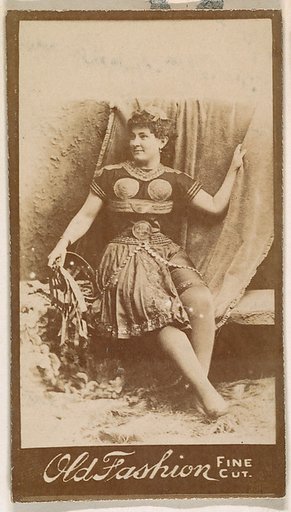 Actress holding studio curtain, from the Actresses series (N664) promoting Old Fashion Fine Cut Tobacco