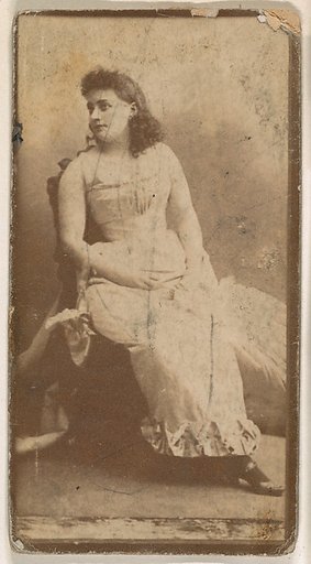 Actress seated with hands on lap, from the Actresses series (N664) promoting Old Fashion Fine Cut Tobacco