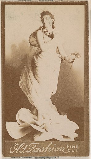 Actress holding metal staff, from the Actresses series (N664) promoting Old Fashion Fine Cut Tobacco