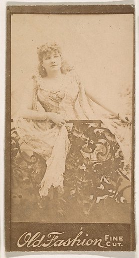 Actress standing behind iron railing, from the Actresses series (N664) promoting Old Fashion Fine Cut Tobacco