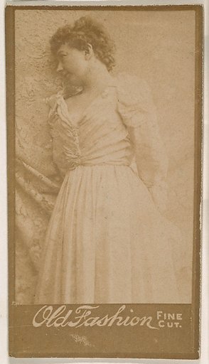 Actress leaning against studio curtain, from the Actresses series (N664) promoting Old Fashion Fine Cut Tobacco