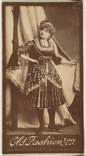 Actress holding studio curtain, from the Actresses series (N664) promoting Old Fashion Fine Cut Tobacco
