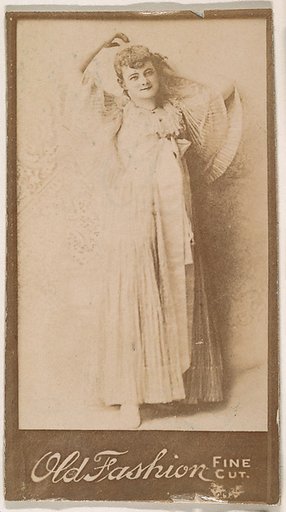 Actress leaning against wall, from the Actresses series (N664) promoting Old Fashion Fine Cut Tobacco