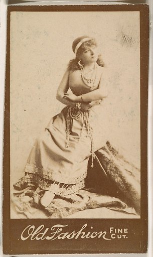 Actress seated with arms folded, from the Actresses series (N664) promoting Old Fashion Fine Cut Tobacco