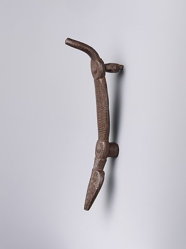 Door knocker in the shape of a crocodile-like creature