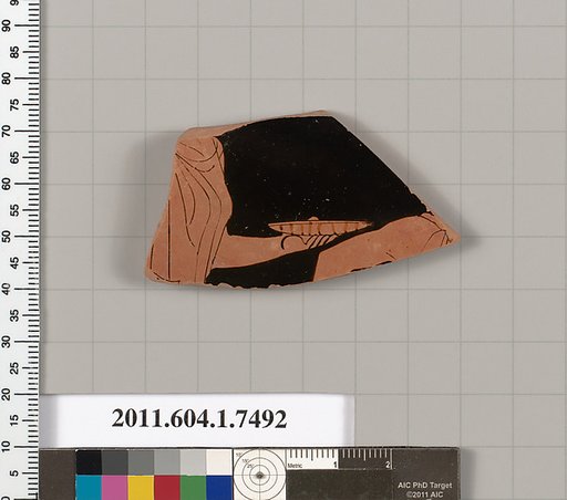 Terracotta fragment of a kylix (drinking cup)