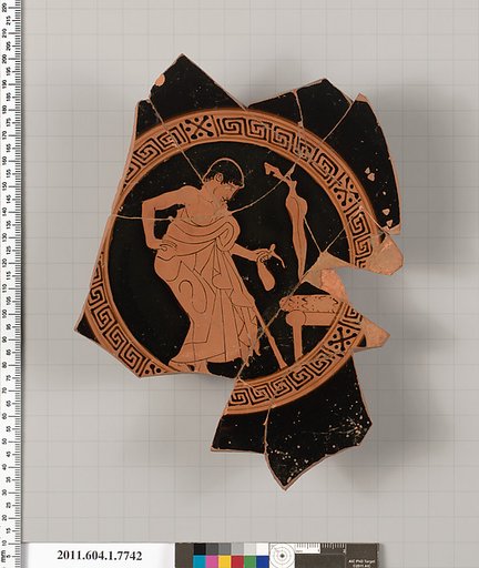 Terracotta fragment of a kylix (drinking cup)