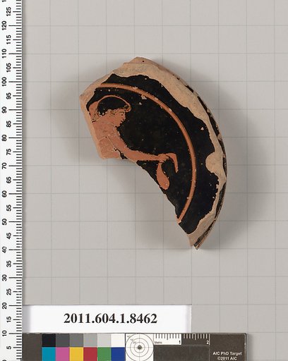 Terracotta fragment of a stemless kylix (drinking cup)