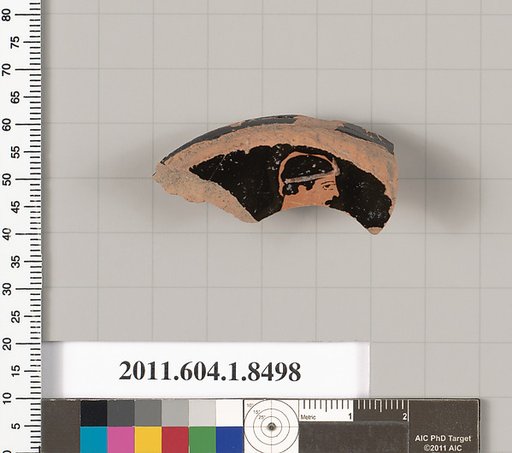 Terracotta fragment of a stemless kylix (drinking cup)
