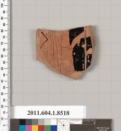 Terracotta fragment of a stemless kylix (drinking cup)