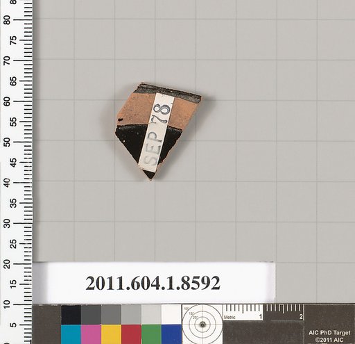 Terracotta fragment of a stemless kylix (drinking cup)