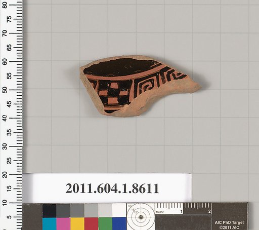 Terracotta fragment of a stemless kylix (drinking cup)