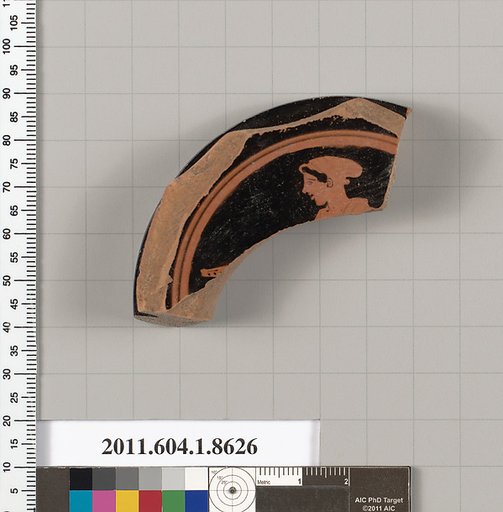 Terracotta fragment of a stemless kylix (drinking cup)
