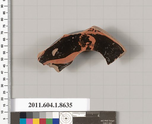 Terracotta fragment of a stemless kylix (drinking cup)